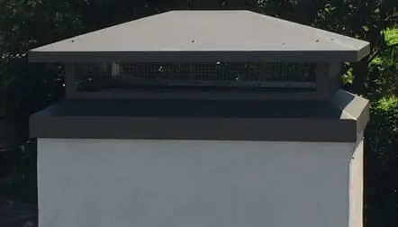 Modern chimney with metal cap