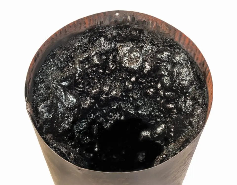 Black tar inside a barrel